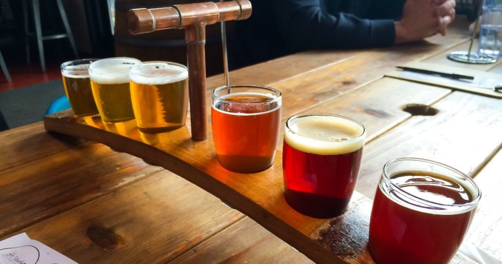 Craft beer types and beer styles on paddle.